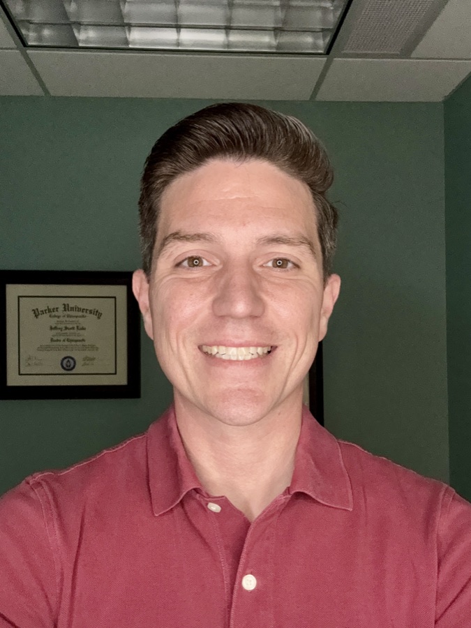 Dr. Jeff Luke, D.C., smiling in his Georgetown office